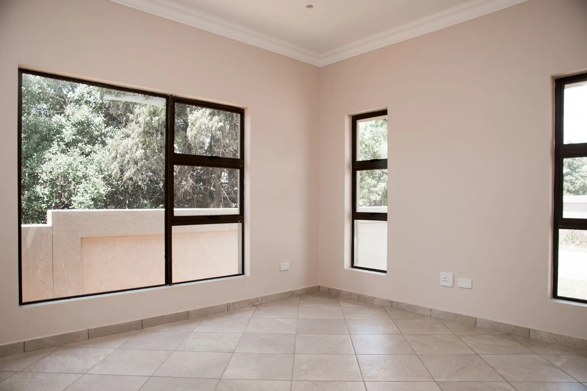 Empty room with large windows